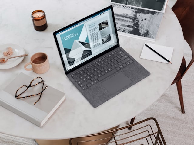 Laptop on a desk showing a search strategy document